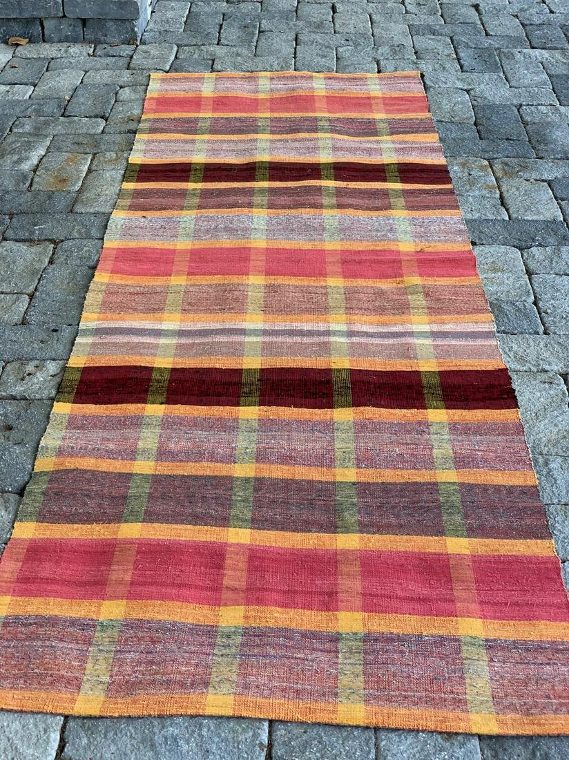 Early 20th c Rag Carpet (unused): Title: Early 20th c Rag Carpet (unused) Description: Complex plaid with color gradation, mustard & yellow striping with salmon & deep red bands & black threading Dimension: 9 ft 6 in. x 38 1/2 in. Cir