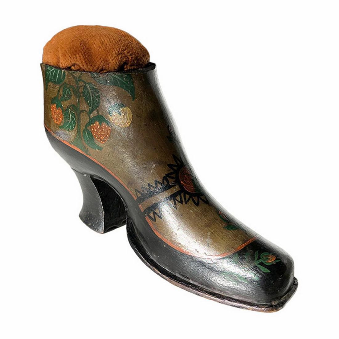 Shoe Pin Cushion: Title: Shoe Pin Cushion Provenance/Additional Info: Carved from a single piece of wood and naively paint decorated with what appear to be strawberry bushes. This shoe pincushion is a great piece of fo