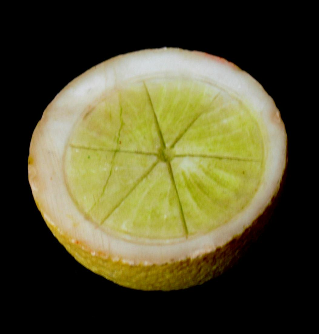 RARE ½ stone lemon.: Title: RARE ½ stone lemon. Description: Very rare ½ stone lemon in great condition with a nice patina. Dimension: life size Circa: 1940's Shipping: Domestic: Flat-rate of $20.00 to anywhere within t