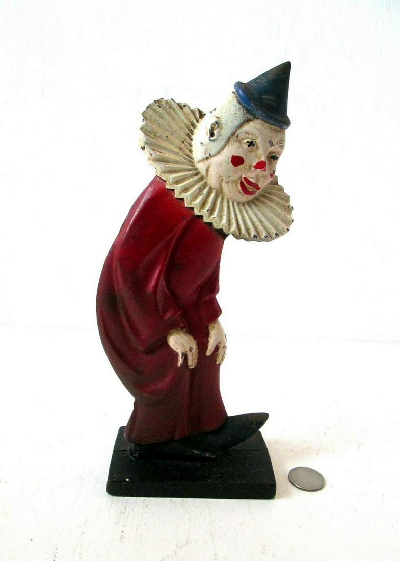 Rare Clown Doorstop: Title: Rare Clown Doorstop Date: C 1920’s Material: Cast Iron Dimension: 10 1/2”H X 4 1/8”W X 2 1/2”D Provenance/Additional Info: Vibrant original paint, flattened full body form, on integral 