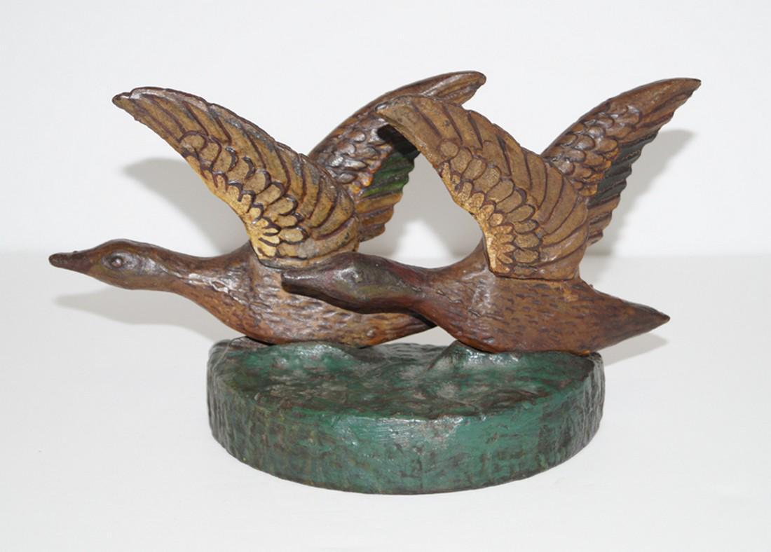 Antique Pair of Ducks Cast Iron Doorstop: Title: Antique Pair of Ducks Cast Iron Doorstop Origin: Date: Circa 1920’s. Dimension: 5 ½” tall x 9 ¾” wide x 3 ¼” deep Provenance: Offering for sale an unusual Ant