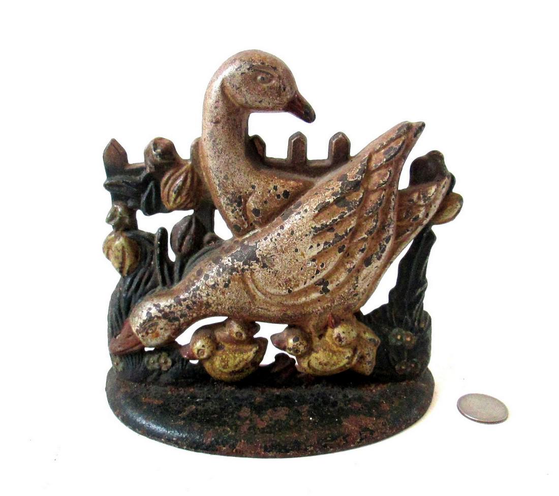 Ducks & Ducklings Doorstop: Title: Ducks & Ducklings Doorstop Date: C 1920’s Dimension: 6 1/2”H X 6 7/8”W X 2 1/2”D Provenance/Additional Info: Intricate ½ round hollow casting, well detailed, depicting two ducks, four 