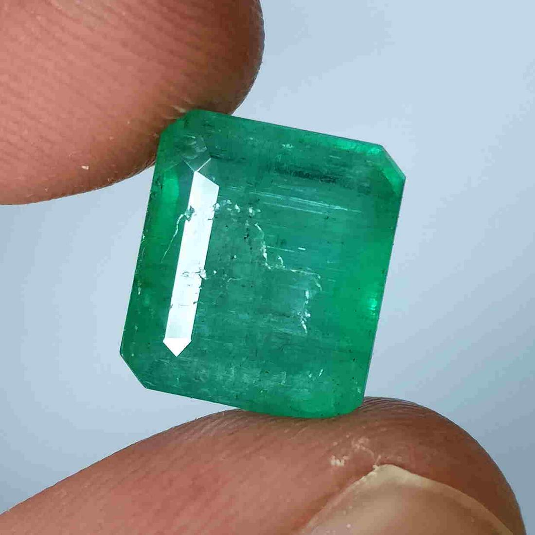 5.05CT Natural untreated Zambian Emerald Octagon cut: Title: 5.05CT Natural untreated Zambian Emerald Octagon cut Good Luster Gemstones Brand: MRS GEMS Carat Weights: 5.05 Size/Dimensions: 11.0x9.6x6.0MM Reserve: $220.00 Shipping: Domestic: Flat-rate of