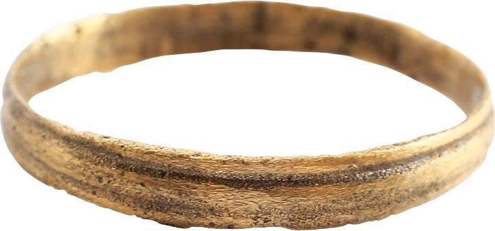 VIKING WOMAN’S WEDDING RING, 10TH-11TH CENTURY AD SZ 7: The band with two grooves at the edges and slightly rounded medial, 2.8mm in width. The surface very lightly textured from burial. Professionally refurbished with the 24karat gold surface restored. Gi