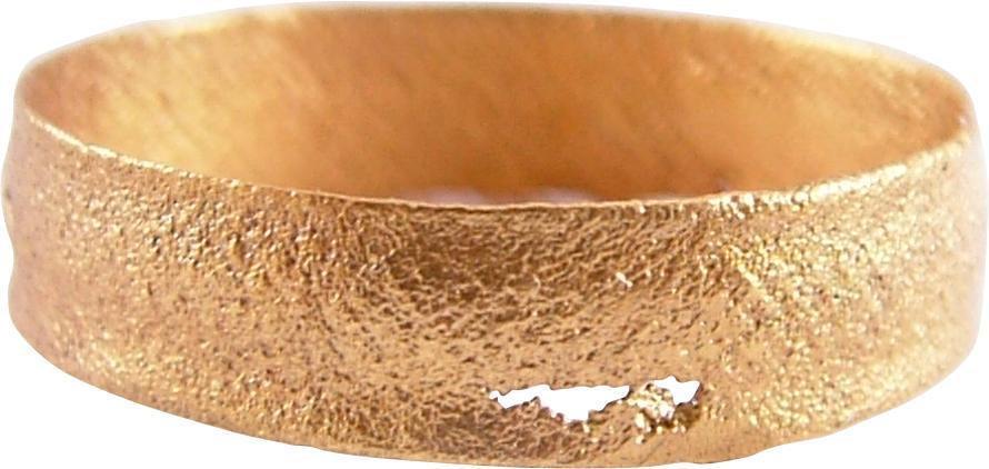 VIKING WEDDING RING, 866-1067 AD JEWELRY S 8 ¾: SIZE 8 3/4. Flat face band, 4.9mm width with slightly sunk borders, and hatched medial. The surface worn and textured from burial. The 24karat gold surface professionally restored. Vikings exchanged r