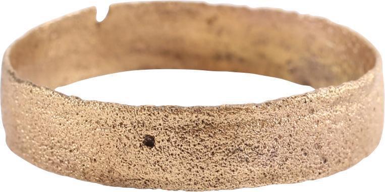 ANCIENT VIKING WEDDING RING SZ 9 1/4: Late 9th-early 11th. Gilt bronze, size 9 1/4. Broad, 4.4mm band, flat with lined edges. Surface textured from burial. Professionally refurbished with the 24karat gold overlay restored. Gift boxed with