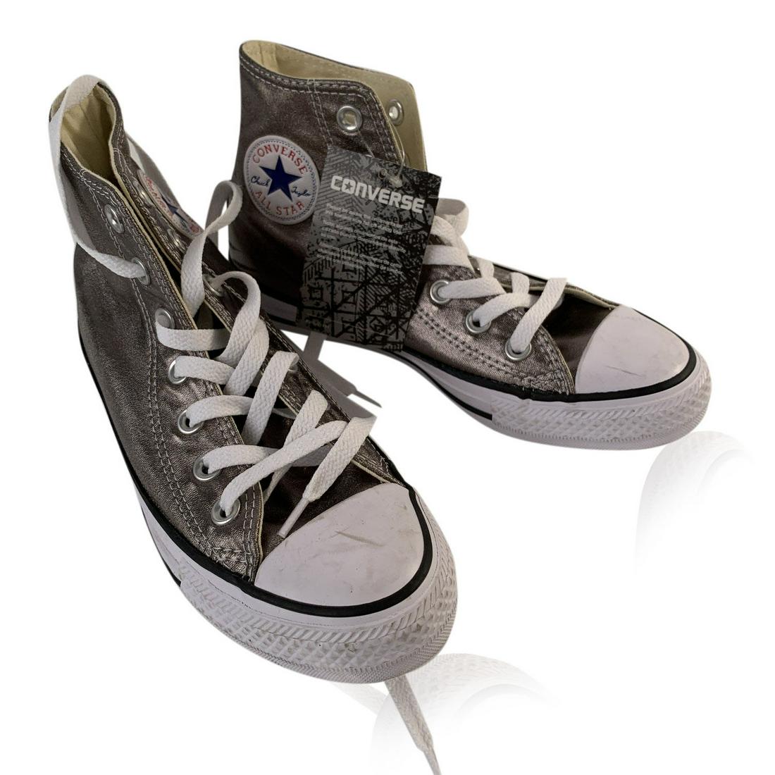 Converse All Star Chuck Taylor Silver High Shiny Metal: All Star High Shiny Women's Sneaker crafted in silver metal canvas - Featuring lace-up closure with tonal laces - Rounded rubber toe - Logo patch details - Cotton canvas lining - Classic rubber sole -