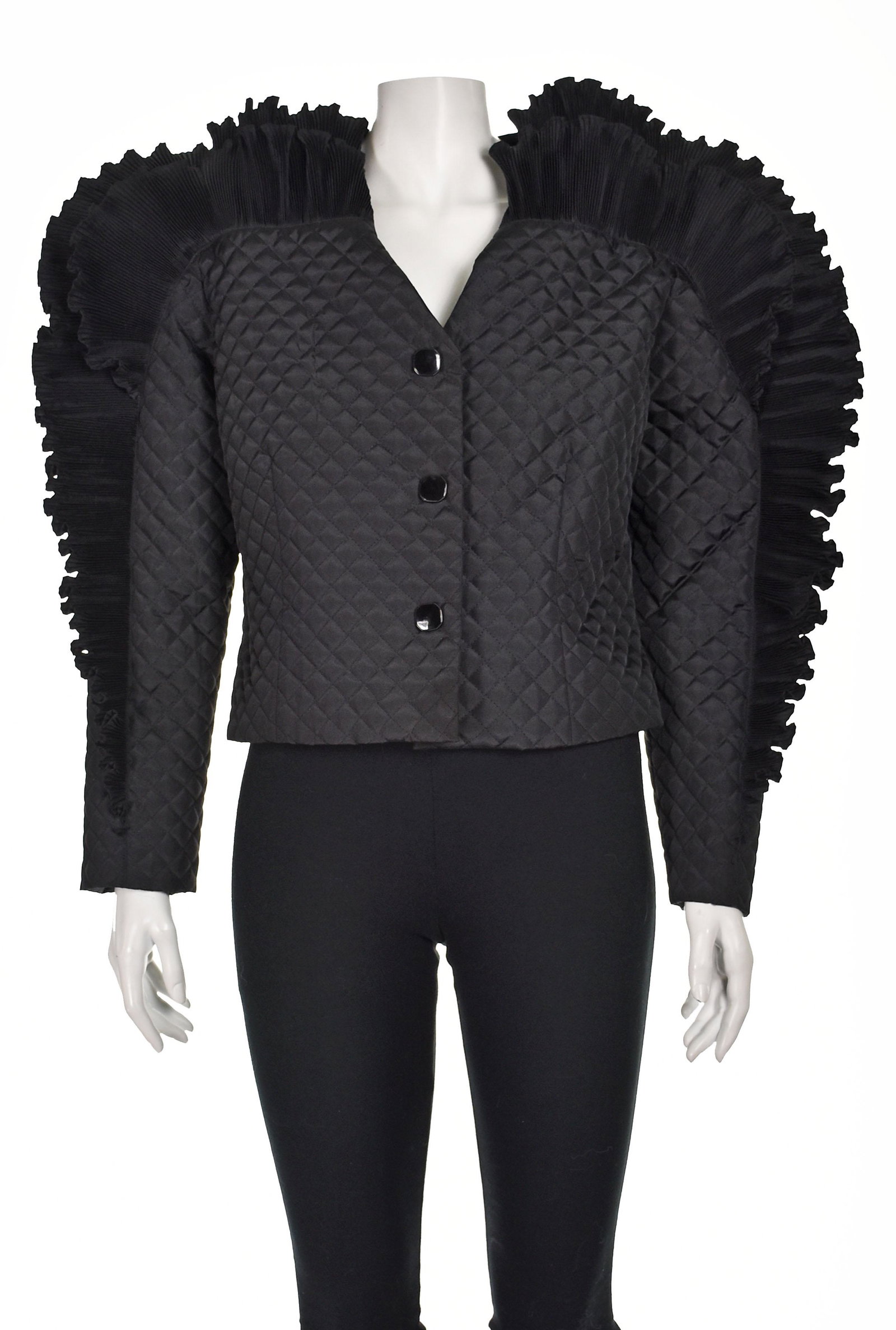 ORO SOLO Unique Black Quilted Jacket: We've never seen anything quite like this unique jacket with its densely pleated "wings" surrounding the shoulders and arms (a la Issey Miyake). It closes with three snaps hidden behind black buttons