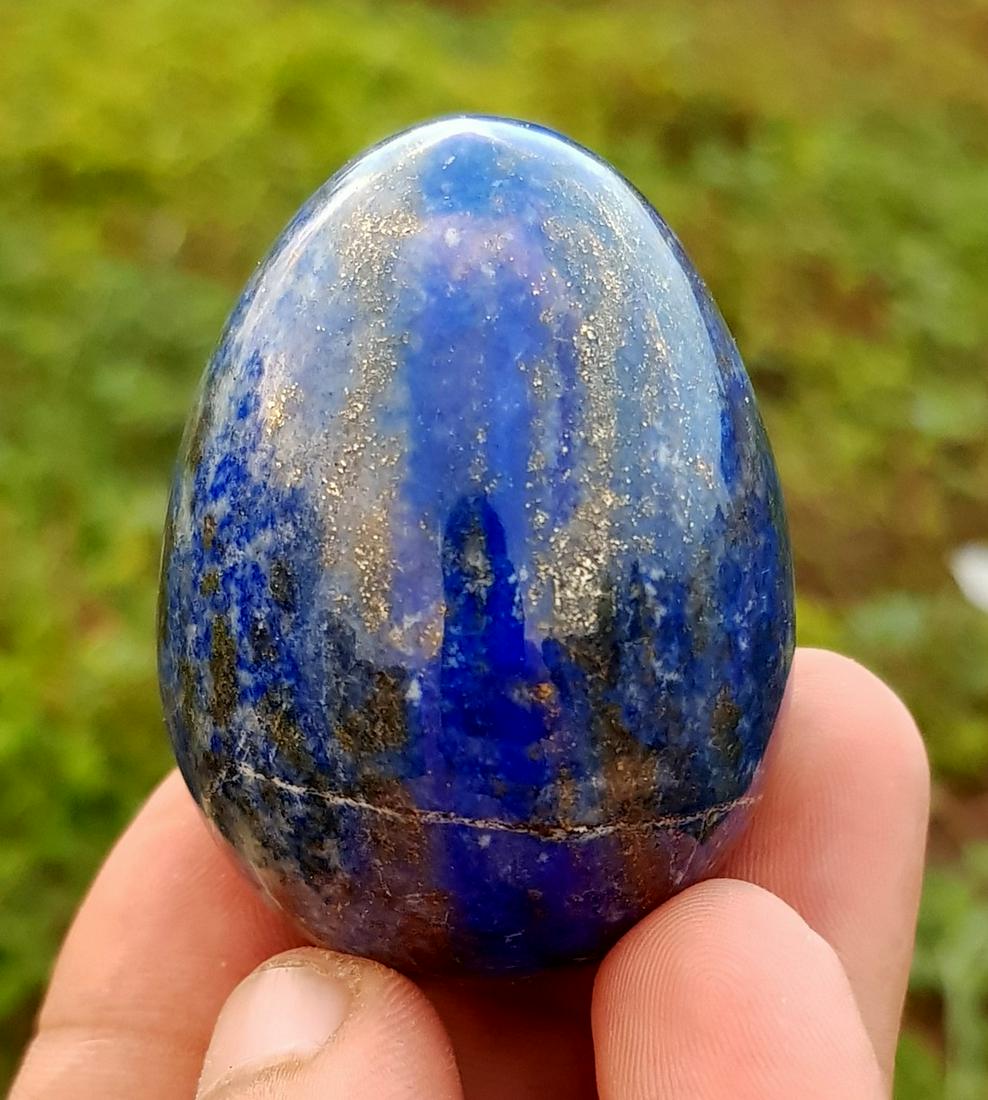 130 Gram Top Lapis Lazuli Egg: Title: 130 Gram Top Lapis Lazuli Egg Weight: 130 Gram Size/Dimension: 53x39x39 mm Origin: Afghanistan Reserve: $20.00 Shipping: Domestic: Flat-rate of $15.00 to anywhere within the contiguous U.S. In