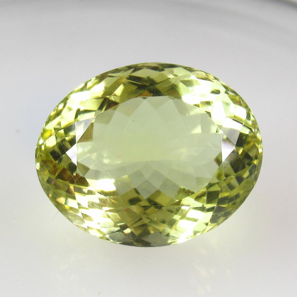 27.60 Ctw Natural Lemon Quartz Oval Cut: Title: 27.60 Ctw Natural Lemon Quartz Oval Cut Stone Clarity: VVS Gemstones: Lemon Quartz Carat Weights: 27.6 Size/Dimensions: 21.00 x 16.80 x 12.90 mm Additional Information: Good Luster / Top Class 