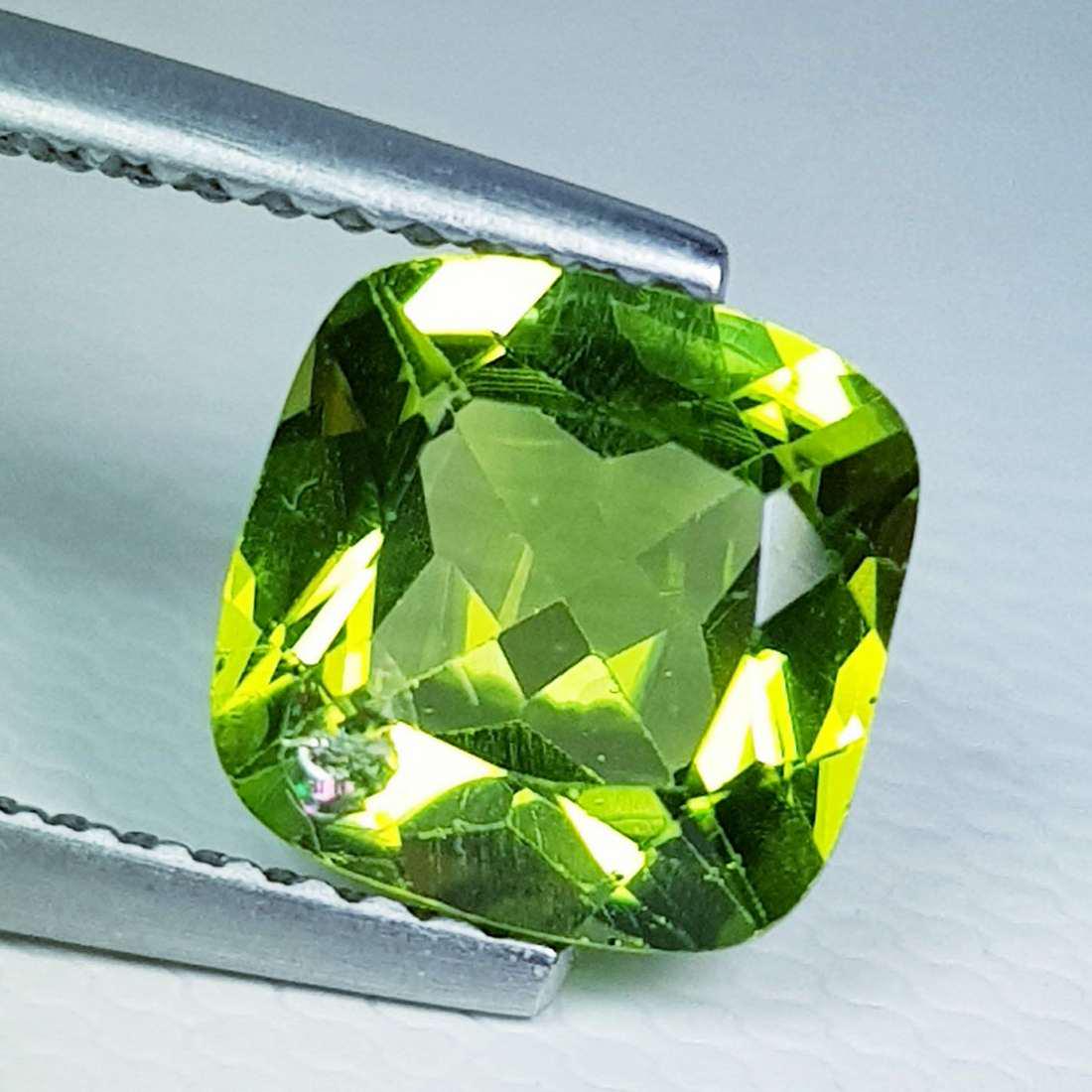 2.03 ct Natural Peridot Cushion Cut: Gemstone: Peridot Title: 2.03 ct Natural Peridot Cushion Cut Color/Clarity: VVS Carat Weight: 2.03 Dimensions: 7.80 x 7.80 x 4.40 Additional Information: Cushion - Pakistan Reserve: $10.00 Shipping:<