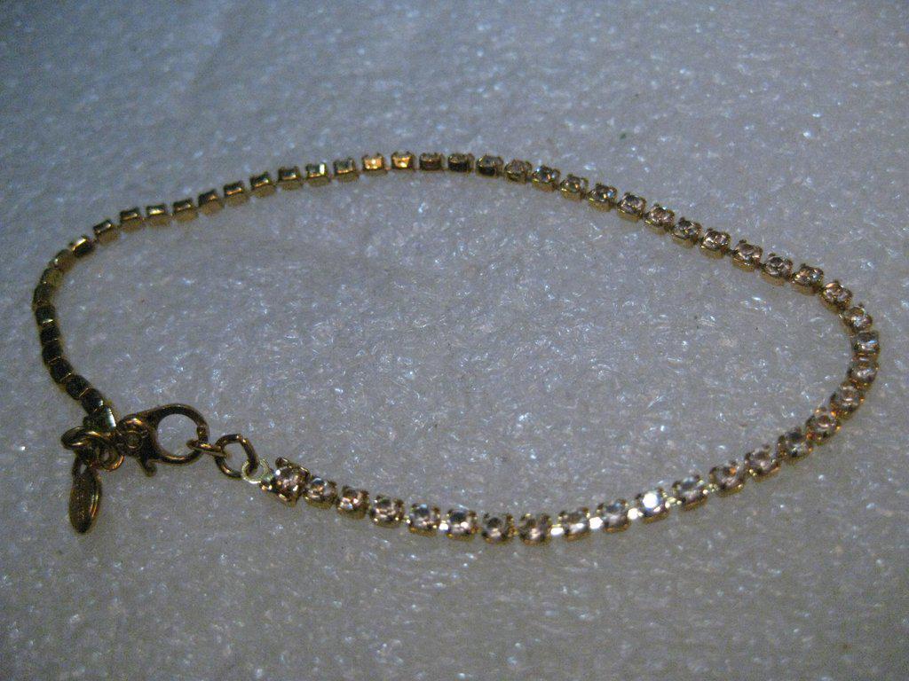 Vintage Monet Rhinestone Bracelet, Clear, 7.5", 2.1mm: Vintage 1980's Monet Rhinestone Bracelet. This is 7.5" long and about 2.1mm wide. It has a Monet tag at the clasp and the handcuff style clasp. The stones are clear and bright - looks new. See photos.
