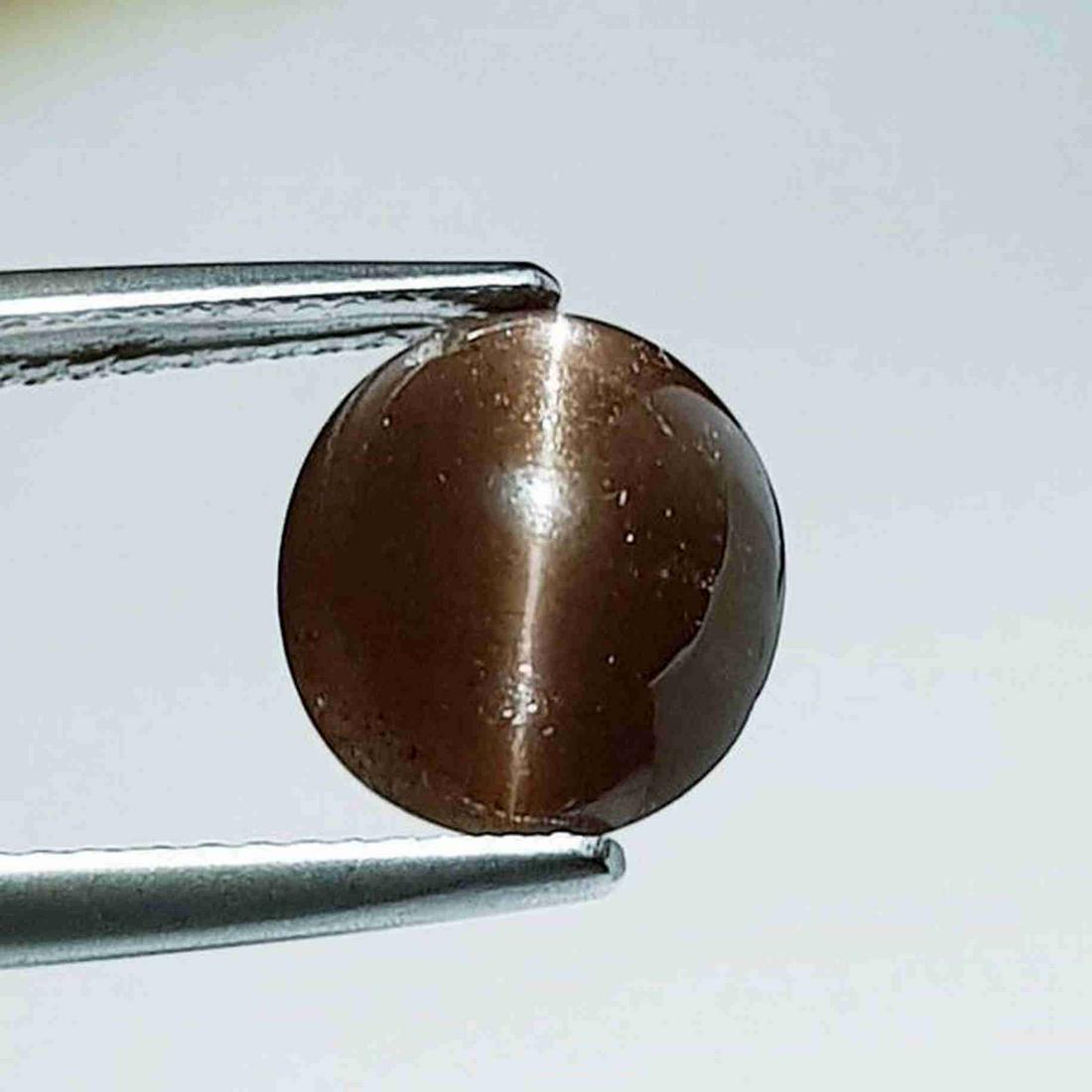 Natural Scapolite Cat's Eye 4.43 ct: No Reserve! Title: Natural Scapolite Cat's Eye 4.43 ct Color/Clarity: Opaque Carat Weight: 4.43 Dimensions: 10.70 x 9.40 x 6.00 Additional Information: Oval - Srilanka Shipping: Domestic: Flat-rate o