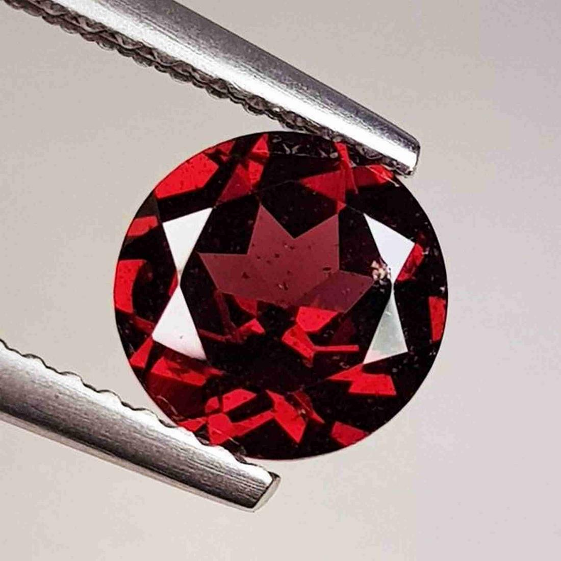 Natural Rhodolite Garnet Round Cut 1.44 ct: No Reserve! Title: Natural Rhodolite Garnet Round Cut 1.44 ct Color/Clarity: VVS - VS Carat Weight: 1.44 Dimensions: 6.98 x 6.98 x 3.70 Additional Information: Round - Burma Shipping: Domestic: Flat-