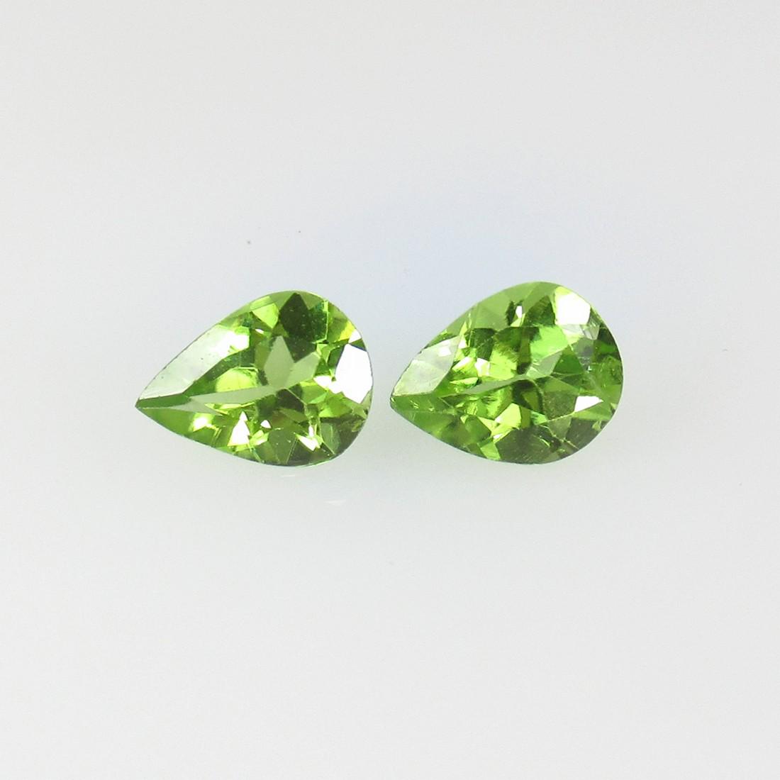 2.11 Ctw Natural Pakistan Peridot Pear Pair: No Reserve! Title: 2.11 Ctw Natural Pakistan Peridot Pear Pair Stone Clarity: VVS Gemstone: Peridot Carat Weight: 2.11 Dimensions: 7.80 x 6.20 x 4.20 mm / 2 PC's Additional Information: Top Class Lust