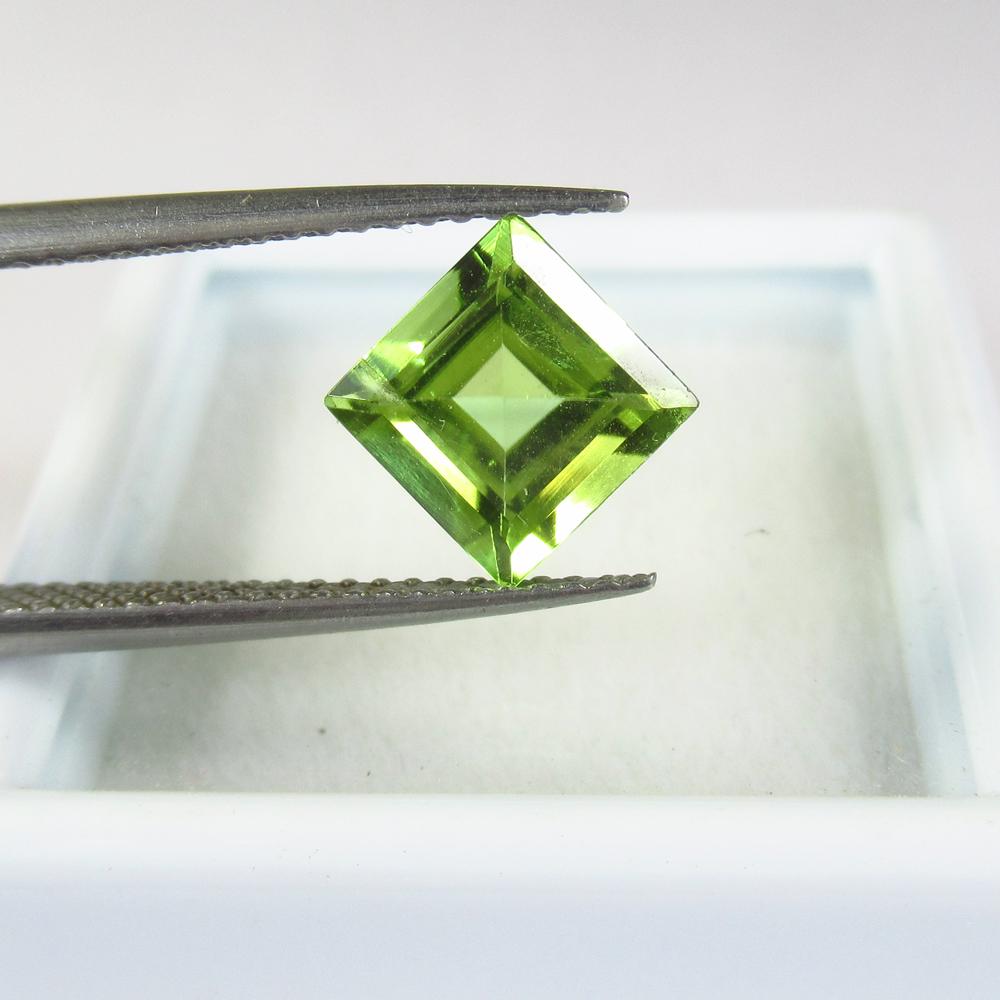 1.73 Ct Natural Pakistan Peridot Square Cut: No Reserve! Title: 1.73 Ct Natural Pakistan Peridot Square Cut Stone Clarity: VVS Gemstone: Natural Peridot Carat Weight: 1.73 Size/Dimensions: 7.00 x 7.00 x 4.30 mm Additional Information: Top Class 