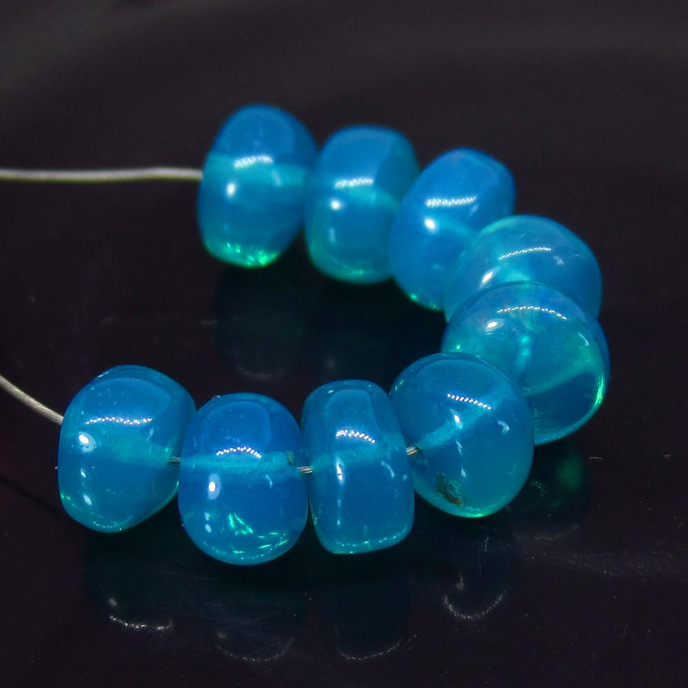 6.50 Ct Natural 9 Drilled Neon Blue Fire Opal Beads: No Reserve! Title: 6.50 Ct Natural 9 Drilled Neon Blue Fire Opal Beads Stone Clarity: Translucent Gemstone: Natural Opal Beads Carat Weight: 6.50 Size/Dimensions: 5.80 to 6.00 mm / 9 PC's Additional I