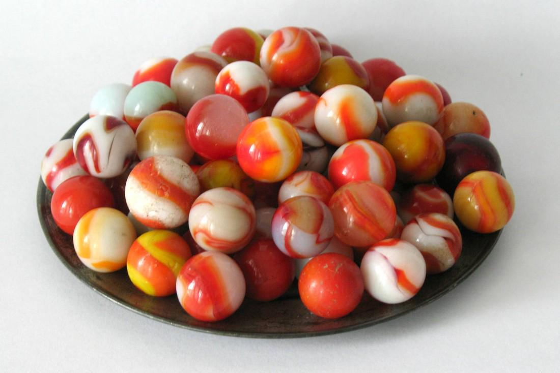 Collection of vintage red & white marbles. (1 of 1)
