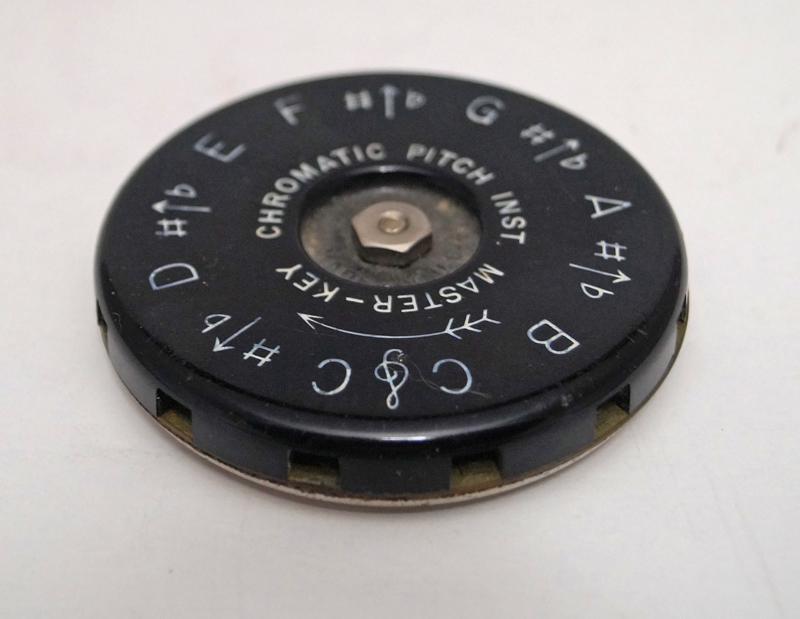 Chromatic Pitch Instrument Master Key: Title: Chromatic Pitch Instrument Master Key Date: Circa 1960's. Dimension: 2 1/2" diameter x app. 3/8" thick. Provenance/Additional Info: A Chromatic Pitch Instrument Master Key. Made by W. Kratt". "