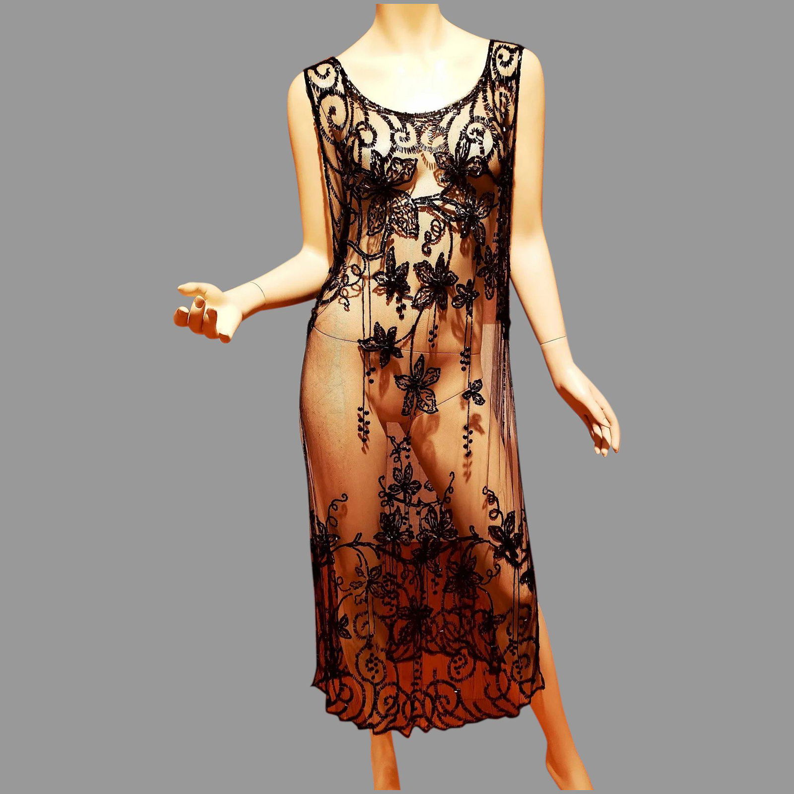 Antique 1910 Museum Tabard Layering Heavily glass onyx: This is Truly an Amazing Museum Wearable Art . A Tabard Flapper fully beaded and sequins dress in a Floral design that is drop dead gorgeous. All Hand embroidered on a black mesh. Bugle beads with sma