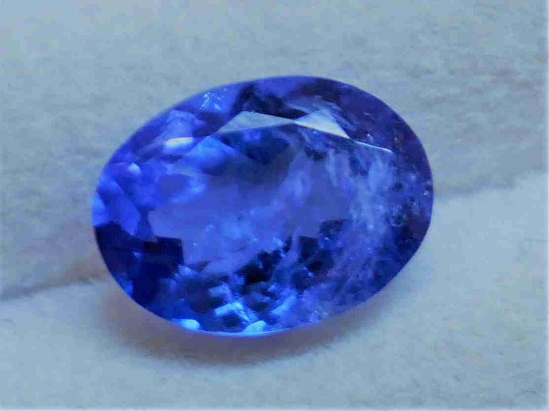 TANZANITE 1.88 ct **OVAL SHAPE**: Title: TANZANITE 1.88 ct **OVAL SHAPE** Gemstone: Tanzanite Carat Weight: 1.88 ct Dimensions: 9.20 x 7.00 x 4.30 mm Reserve: $120.00 Shipping: Domestic: Flat-rate of $18.00 to anywhere within the co