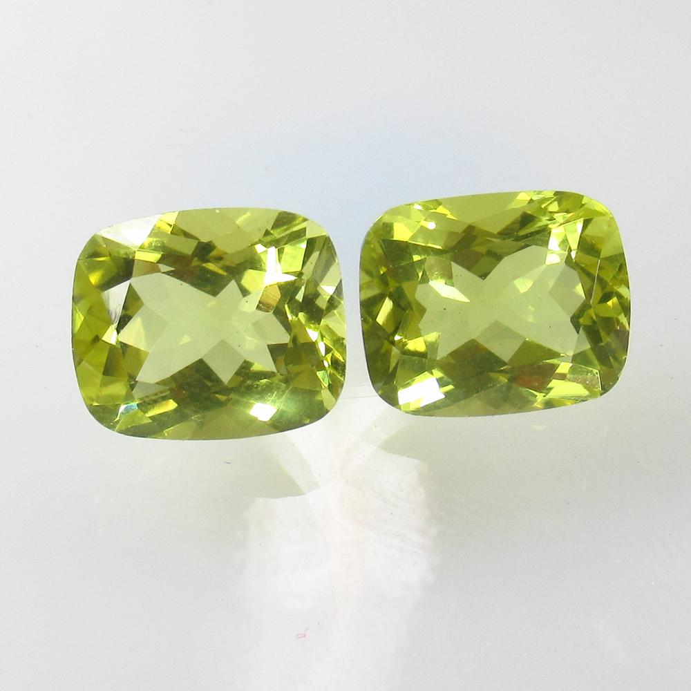 10.68 Ct Natural Lemon Quartz Cushion Pair: Ttle: 10.68 Ct Natural Lemon Quartz Cushion Pair Stone Clarity: VVS Gemstone: Natural Lemon Quartz Carat Weight: 10.68 Dimensions: 12.00 x 10.00 x 7.10 mm / 2 PC's Additional Information: Good Luster 