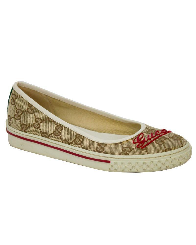 Gucci Monogram Flats: Fashionable Gucci Monogram Flats feature signature brown GG monogrammed canvas, and has red cursive Gucci logo on each toe. White rubber sneaker style sole, embossed with gucci monogram print around t