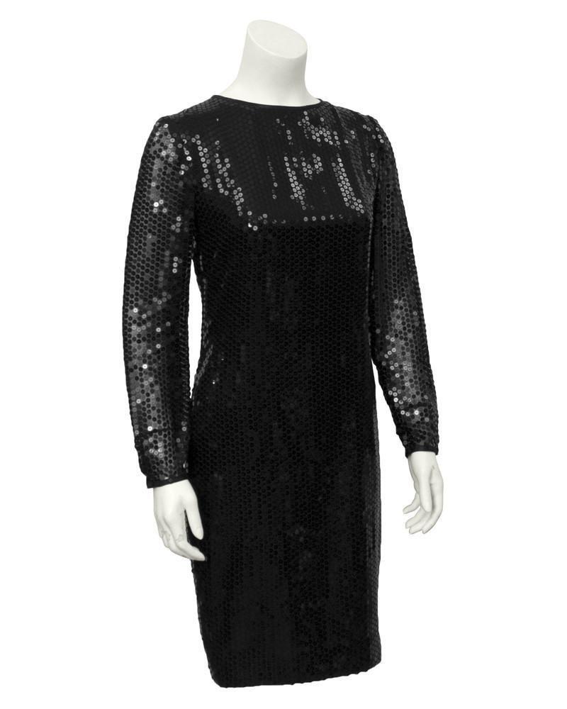 Bellville Sassoon Black Long Sleeve Sequin Dress: 1980's Bellville Sassoon black long sleeve sequin cocktail dress. Sleeves are left unlined and sheer for some sex appeal. Crew neck and invisible zipper up the back. UK 8 Shoulder 18" | Sleeve 15.5" |