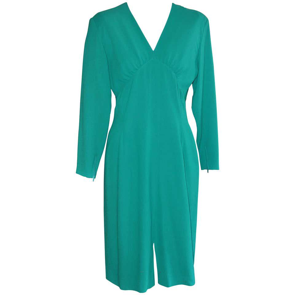 80s Guy Laroche Green Wool Dress (42 Fr): Made of nice fine wool weave, this dress has a v-neck with a gathering detail; zip cuffs, and a front middle vent. Makes an elegant cocktail dress. Dimensions Marked Size: 42 Fr (EU) Bust: 38 in. (96.