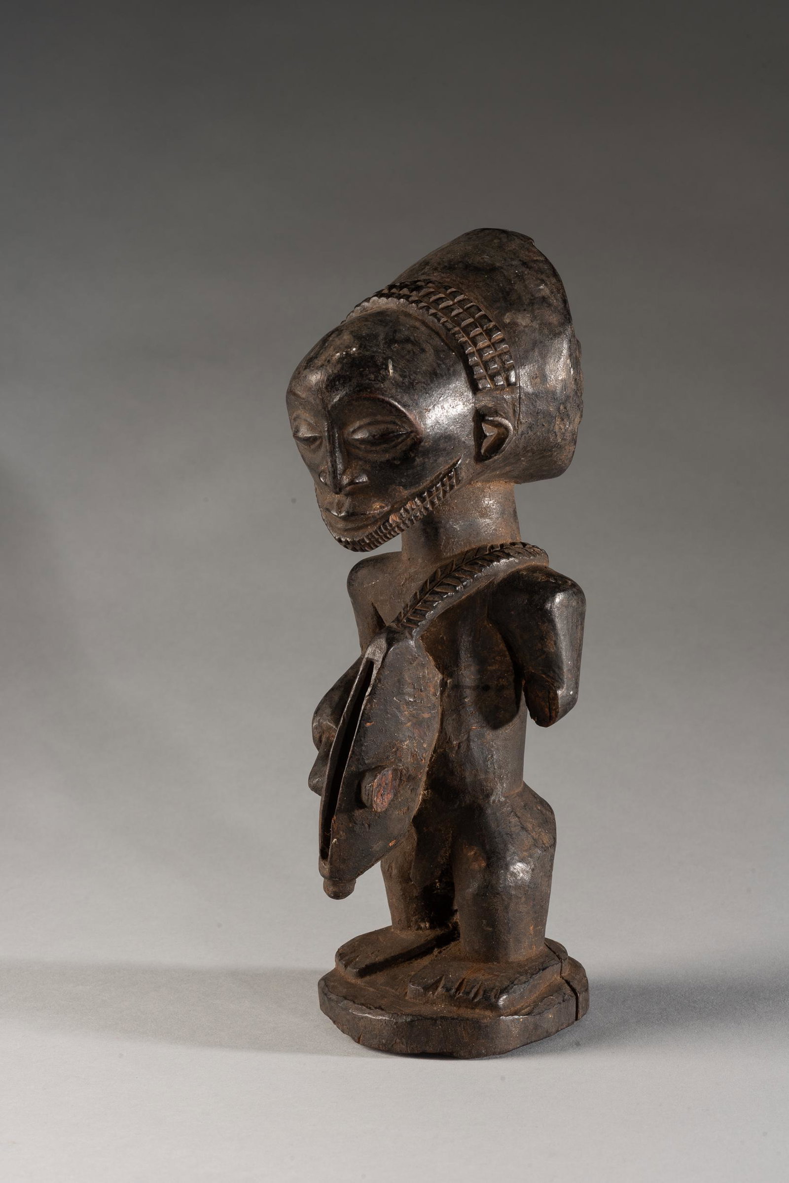 Male Standing Figure carrying Slit Drum, Hemba people,: Title: Male Standing Figure carrying Slit Drum, Hemba people, DR Congo Materials: wood Size: 26.5 x 9 x 8 Reserve: $50.00 Shipping: Domestic: Flat-rate of $70.00 to anywhere within the contiguous U.S.