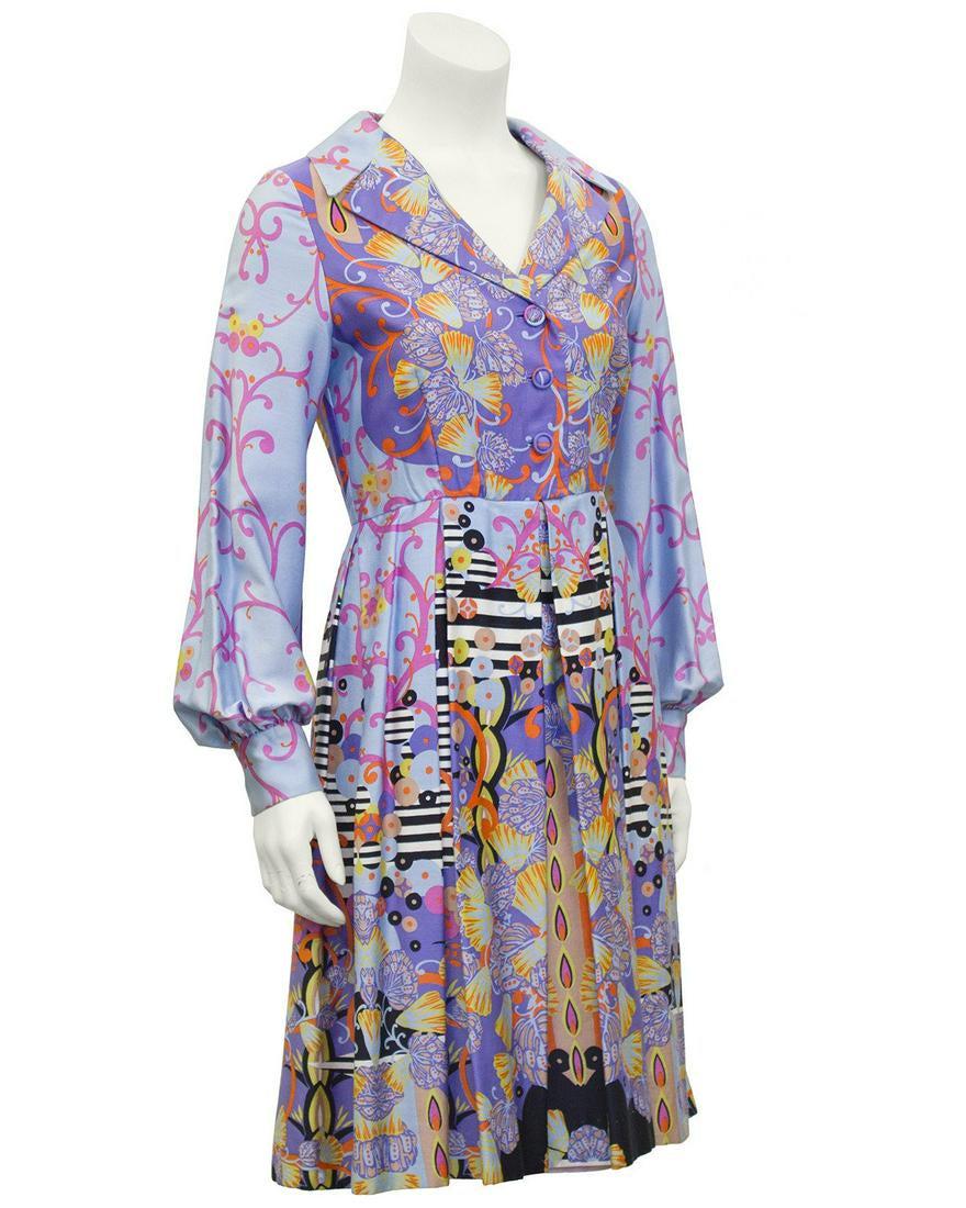 Anonymous Purple Psychedelic Seashell Print Shirt Dress: 1960's psychedelic print shirt dress featuring stunning shades of purple and lilac with pops of orange and yellow, black and white stripes and seashells. Exaggerated collar with matching buttons and p