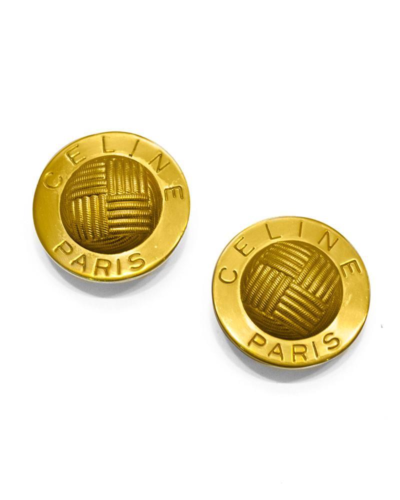 Celine Oversized Gold Plated Clips: Vintage Celine oversized gold plated clip back earrings with cross hatch detail in the middle and 'CELINE PARIS' around the outer edge. In excellent vintage condition. Length 1" | Width 0.75" | Height