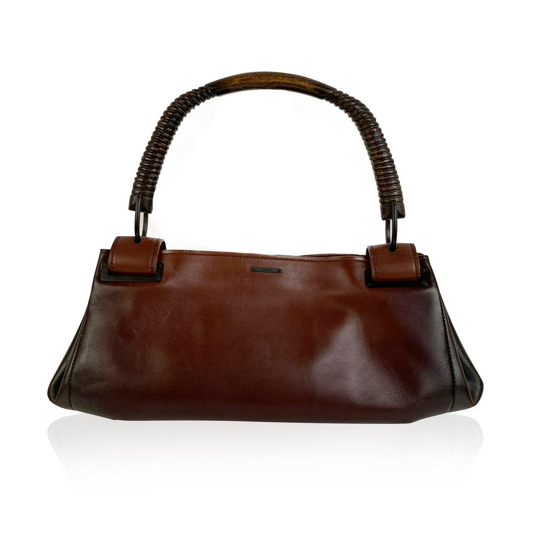 Gucci Gradient Brown Leather Wooden Handle Satchel Bag: Beautiful Gucci satchel in gradient brown leather. Wooden handle. Open top. Monogram fabric lining and 1 side zip pocket inside.'Gucci - Made in Italy' tag inside (serial number on its reverse). Detai