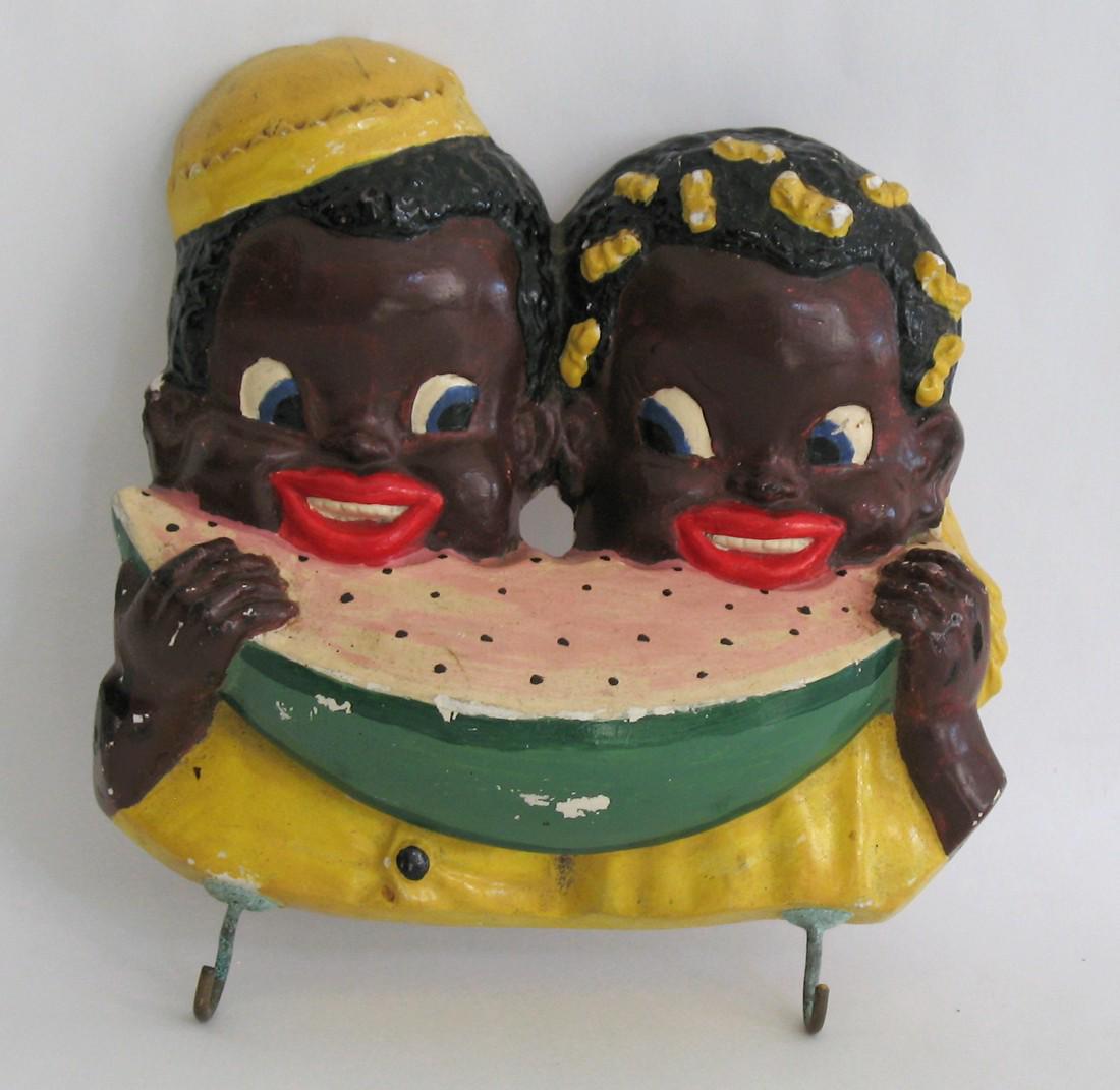 Chalk plaque of two children eating watermelon.: Title: Chalk plaque of two children eating watermelon. Description: Nice early chalk wall plaque of two black children enjoying eating watermelon. All original. Dimension: 5” x 5” Circa: 1940's Sh