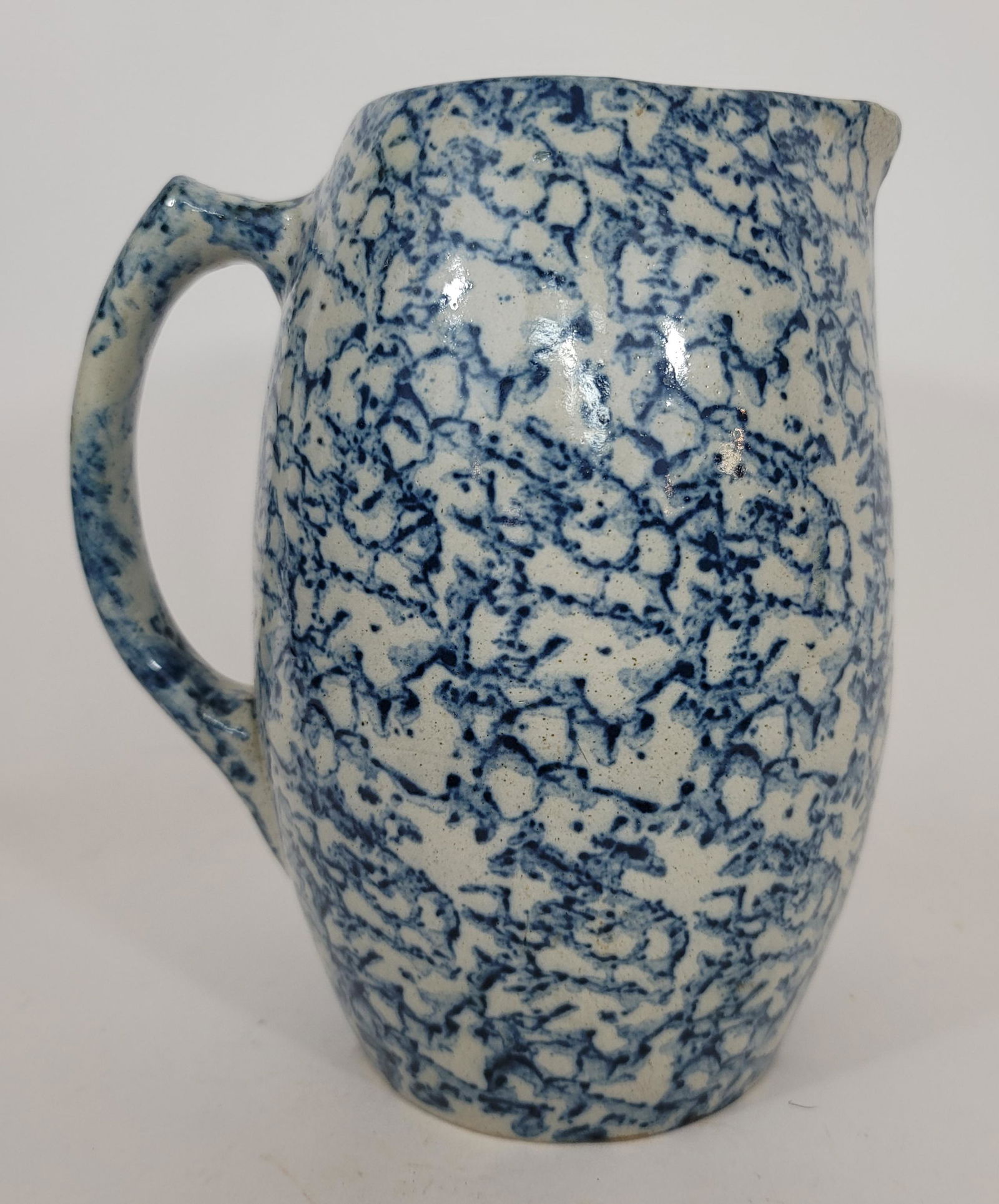 Barrel form blue spongeware pitcher ca 1880: Title: Barrel form blue spongeware pitcher ca 1880 Description: A very nice pitcher in excellent condition. No major flaws. A very fine short line and pin nip at the rim and two small flakes under the
