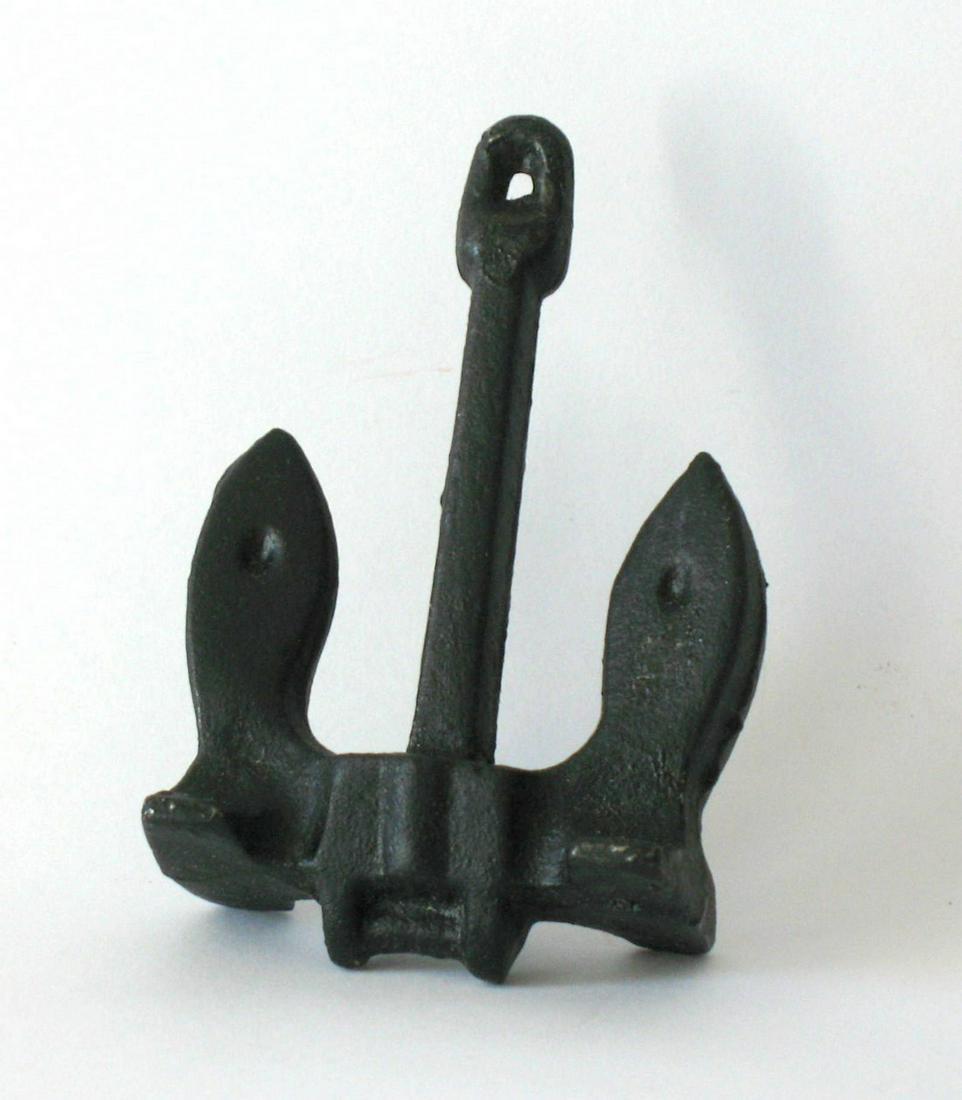 Cast iron anchor paperweight.: Title: Cast iron anchor paperweight. Description: Nice cast iron anchor paperweight. This is old store stock never sold from a long closed coastal Maine gift shop. Dimension: 3” x 2 1/2” Circa: 19