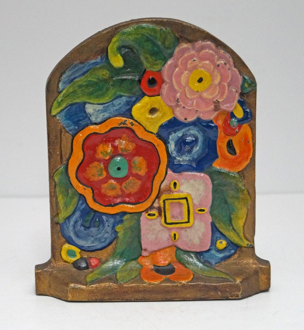 Antique Deco Flowers Cast Iron Doorstop: Title: Antique Deco Flowers Cast Iron Doorstop Date: Circa 1920’s. Dimension: 6 5/8” tall x 5 ¾” wide. Provenance/Additional Info: Eye-appealing group of mixed flowers done in an incredible Dec