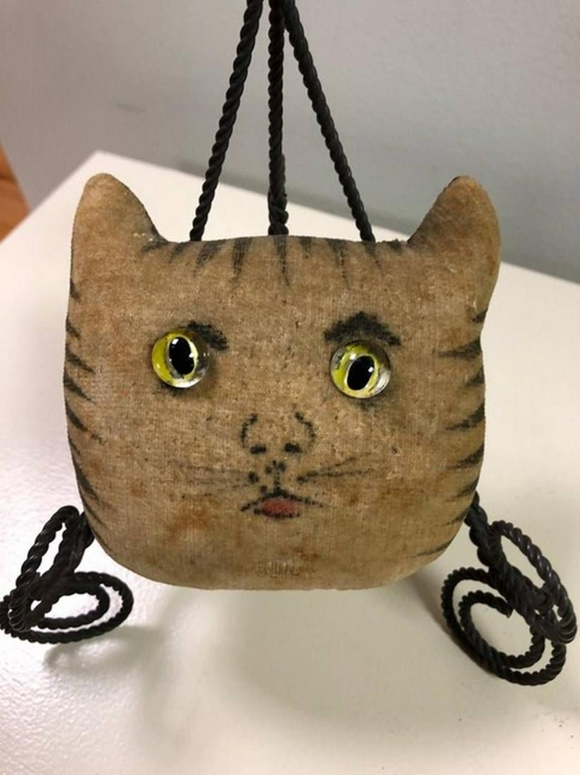 RARE VELVET CAT PIN CUSHION WITH ORIGINAL THEOREM: Title: RARE VELVET CAT PIN CUSHION WITH ORIGINAL THEOREM STRIPES AND GLASS EYES Date: Origin: Dimension: 4 X 3-1/2" Provenance/Additional Info: Shipping: Domestic: Flat-rate of $25.00 to anywhere with