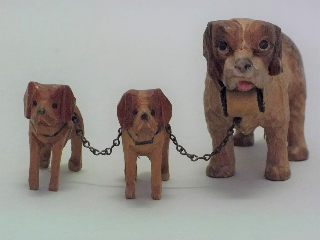 Miniature Wood Carved St. Bernard Mother with Pups: Title: Miniature Wood Carved St. Bernard Mother with Pups Date: 20th c/ Material/Origin: American Dimension: From 1/2" to 2 1/2" high Provenance/Additional Info: Carved and paint decorated wood St. Be