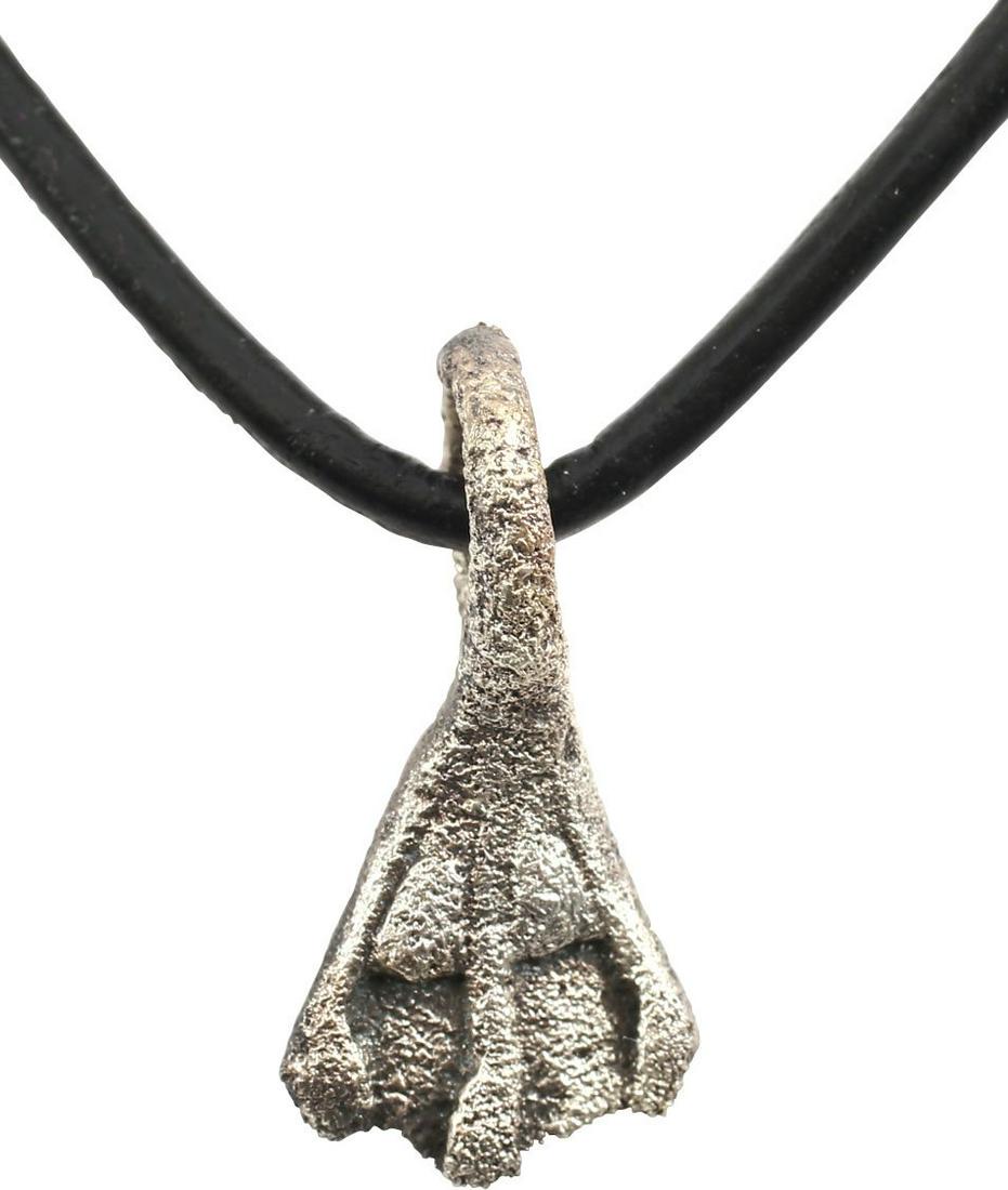 ANCIENT VIKING SORCERER’S AMULET C.850-1050 AD JEWELRY: Slightly over 3/4" height. Bronze, originally silvered, shaped as a finely delineated duck's foot with three toes with claws, thin web between and the arch above. Large suspension loop. A burial at Vi