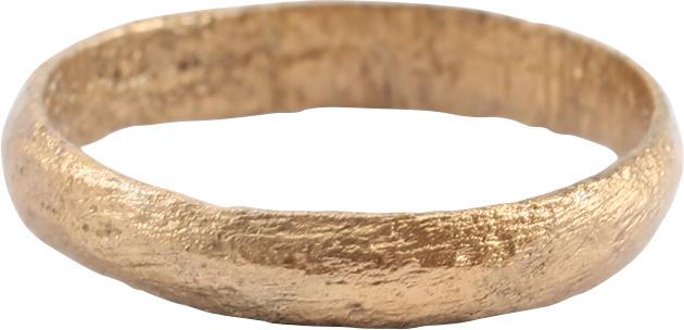 ANCIENT VIKING WEDDING RING, SIZE 6: Late 9th-early 11th. Gilt bronze, size 6. 3.3mm band, rounded with slightly crested medial. Surface textured from burial. Professionally refurbished with the 24karat gold overlay restored. Gift boxed