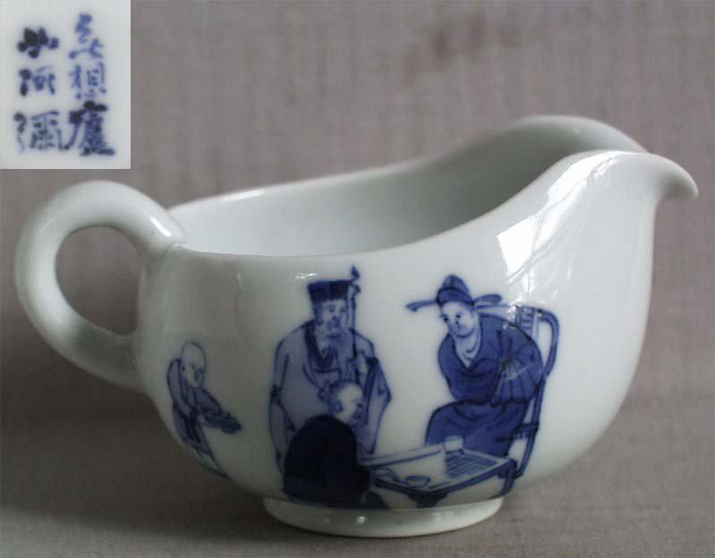 1910s HIRADO Japanese porcelain yusamashi GO players: Late Meiji - early Taisho (1910s) Japanese porcelain Hirado yusamashi with underglaze blue decoration of scholars playing the game of GO on a low table, accompanied by attendant boys. Yusamashi resemb