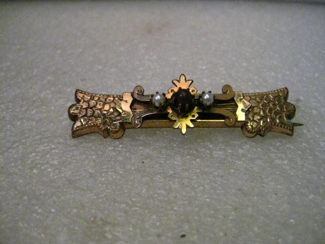 True Vintage Victorian Gold Plated Bar Brooch, Center: Victorian Gold Plated Bar Brooch - detailed and ornate - with a center raised crown like accent with two raised white lustered 3mm pearls and a center garnet to amethyst colored 4.5 mm round stone. Th