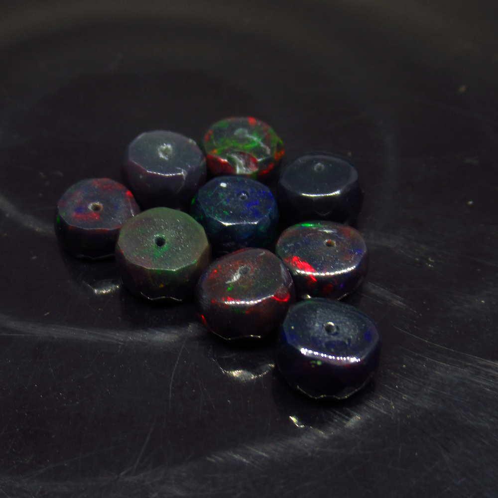 8.55 Ct Natural 9 Drilled Faceted Black Fire Opal Beads: No Reserve! Title: 8.55 Ct Natural 9 Drilled Faceted Black Fire Opal Beads Stone Clarity: Translucent Gemstone: Natural Faceted Black Opal Beads Carat Weights: 8.55 Size/Dimensions: 6.60 to 7.00 mm / 