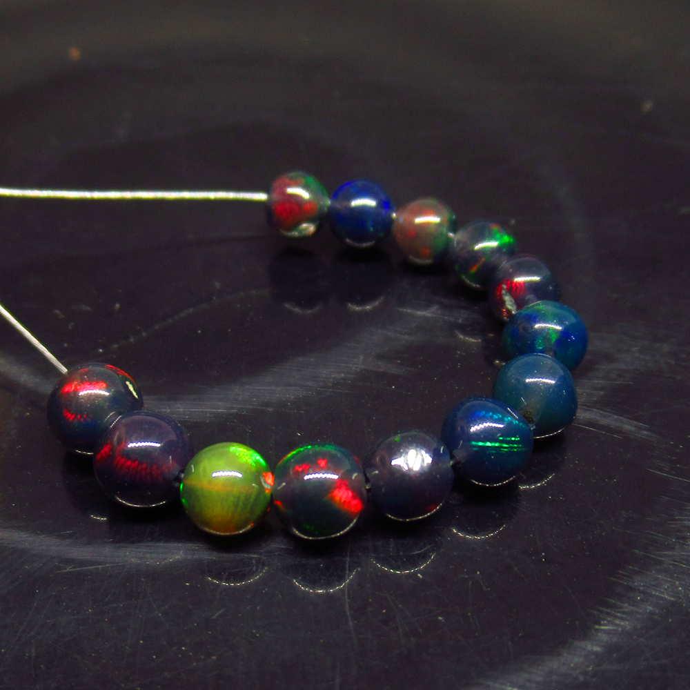3.65 Ct Natural 13 Drilled Black Fire Opal Ball Beads: No Reserve! Title: 3.65 Ct Natural 13 Drilled Black Fire Opal Ball Beads Stone Clarity: Translucent Gemstone: Natural Black Opal Beads Carat Weights: 3.65 Size/Dimensions: 3.70 to 3.90 mm / 13 PC's Dr