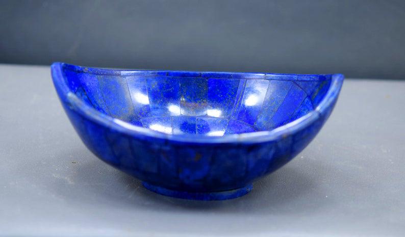 Lapis Bowl 346 Gram Lovely Ship Shape Royal Blue Color: Materials Lapis, lazuli more Description 346 Gram Lovely Ship Shape Royal Blue Color Lapis Bowl ~ Hand Made ~ Hand Craft ~ Jewelry Box Weight : 346 Gram Dimensions ~ 148*105*53 mm Standard DHL Shippin