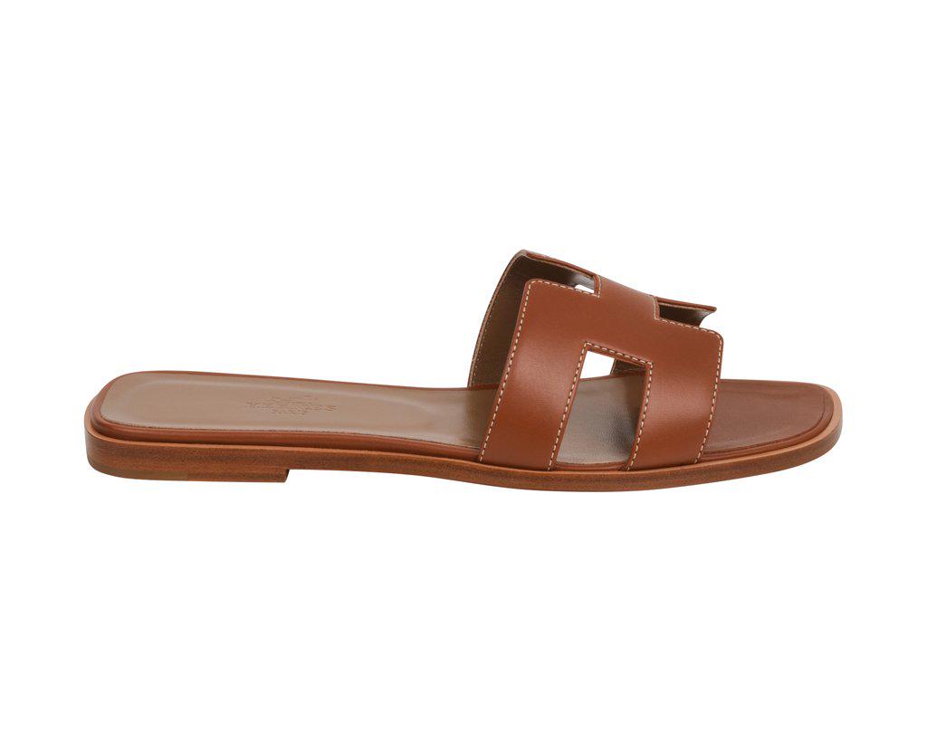 Hermes Sandal Flat Oran Gold Box Calfskin 39 / 9 New W/: Guaranteed authentic Hermes Oran exquisite Gold box calfskin slide. The iconic top stitched H cutout over the top of the foot in sublime calfskin. Gold embossed calfskin insole. Wood heel with leather