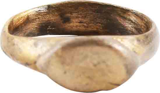 MEDIEVAL WOMAN’S FASHION RING C.1000-1250 AD, SIZE 4 ¾: Christian period, C.1000-1250 AD. Woman’s size 4 3/4. 4.3mm width band slightly narrowing below the shoulders. Raised oval bezel with banded edge. Surface textured from burial. Professionally refurb