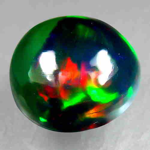 1.60Ct Natural Multi color Black Opal Round Cabochon: Title: 1.60Ct Natural Multi color Black Opal Round Cabochon Good Luster loose gemstone Carat Weight: 1.6 Dimensions: 7.90x7.90x4.90 MM Additional Information: HEATED ETHIOPIAN ORIGIN Reserve: $20.00 S