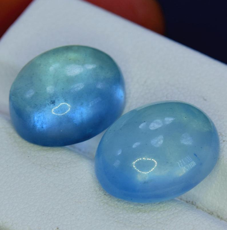 Aquamarine Gemstone , Natural Deep Blue Color Pair of: Material Aquamarine more Description Aquamarine Gemstone , Natural Deep Blue Color Pair of Aquamarine Cabochon Gemstone - Weight : 18.40 Carat Size : 14*12*7 mm Origin : Pakistan Treatment : Natural S